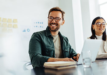 Man and woman sitting in a white office